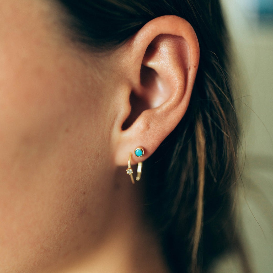 faux turquoise earring studs paired with a horseshoe hoop