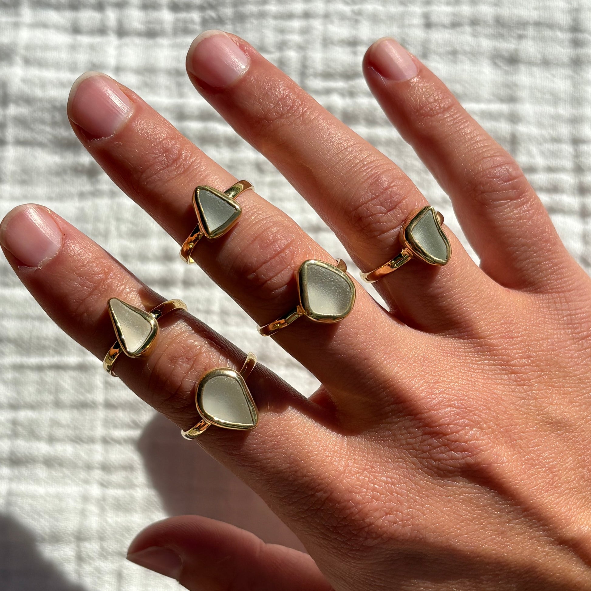 multiple options of white sea glass rings in gold vermeil material