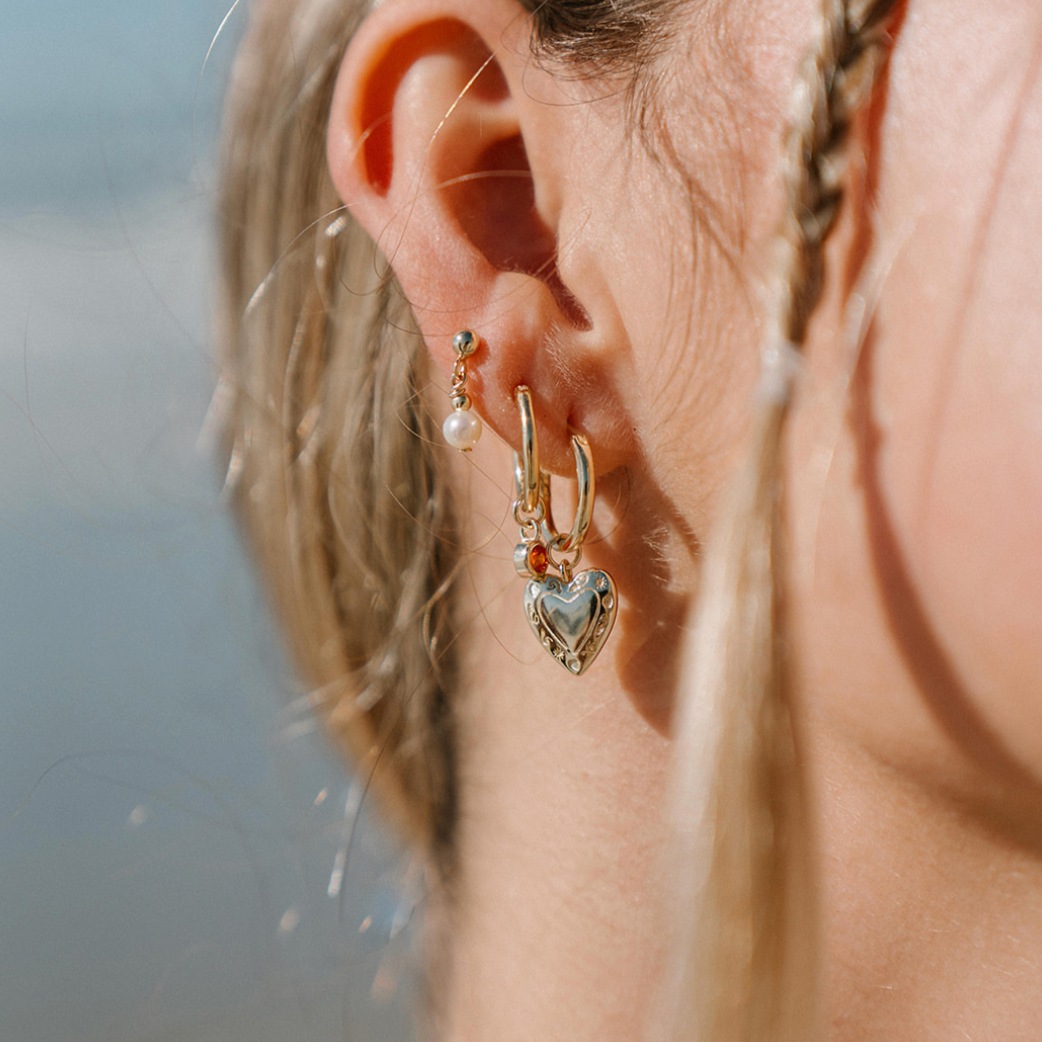 gold earring stack on ear model