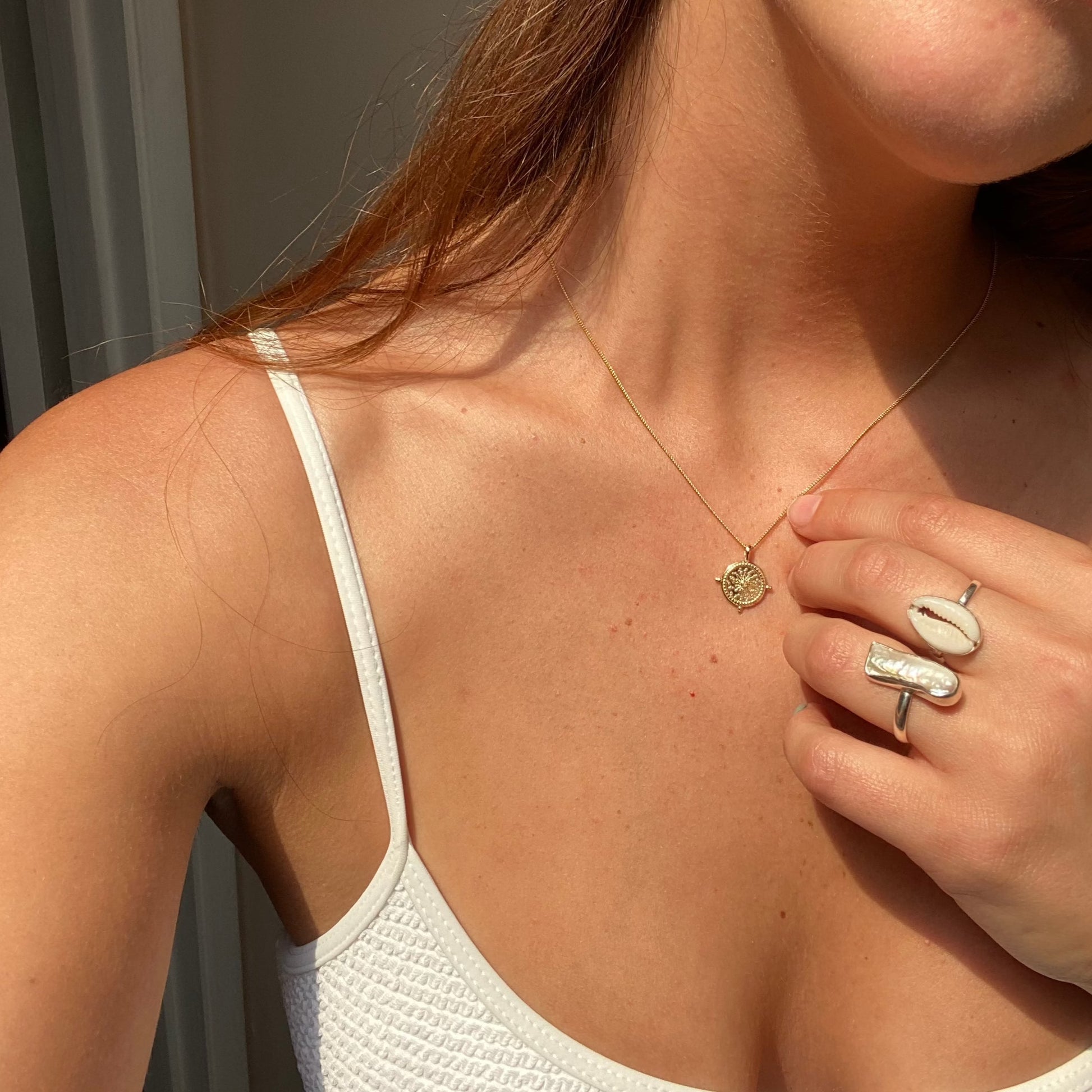 salty gem rings with pearls and shells selfie