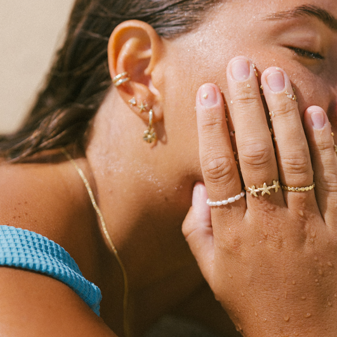 pearl and starfish ring modeled in hawaii at the beach